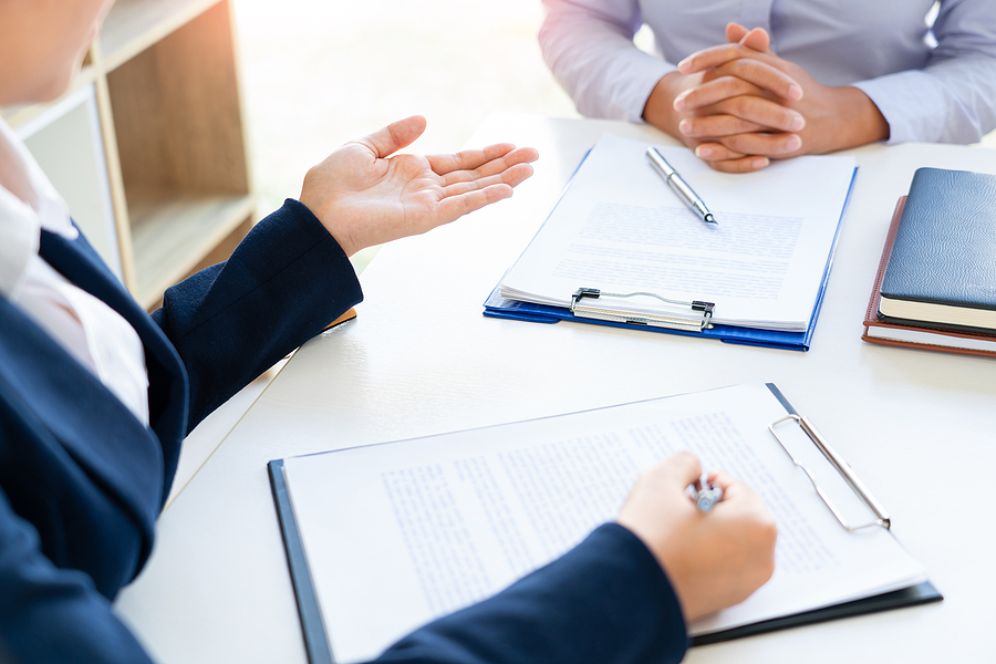 Close up of a woman meeting with her attorney. 